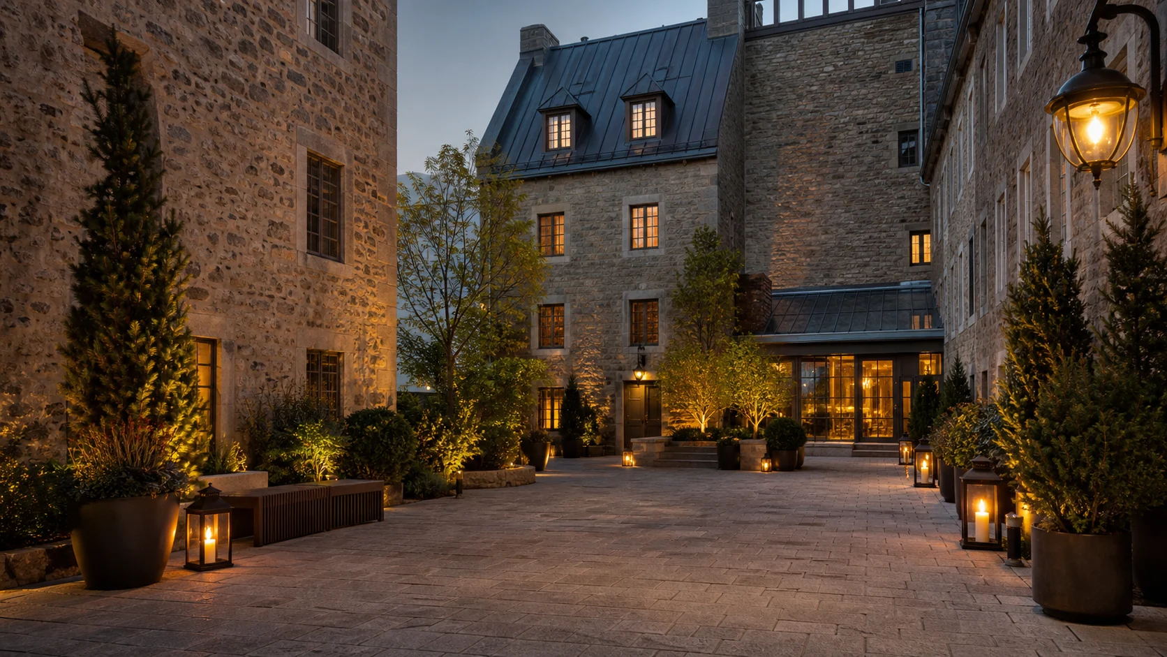 Auberge Saint-Antoine courtyard in Old Quebec City, stone walls and lantern light