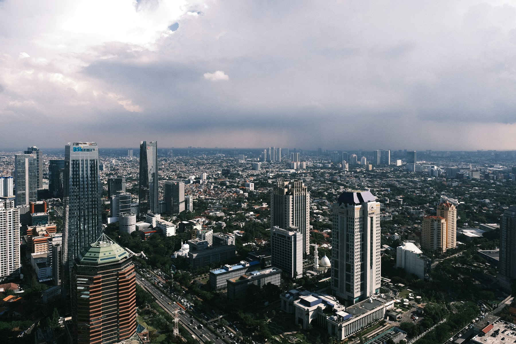 Jakarta cityscape under cloudy skies