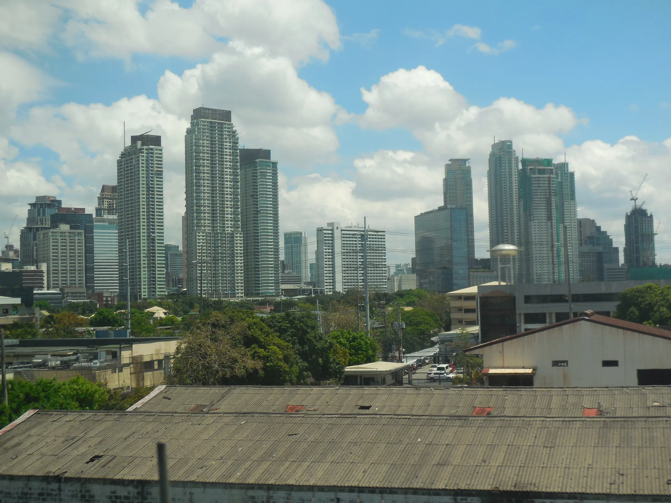 Makati Skyline from Skyway, a stay or neighbourhood image for Makati / Manila, Philippines