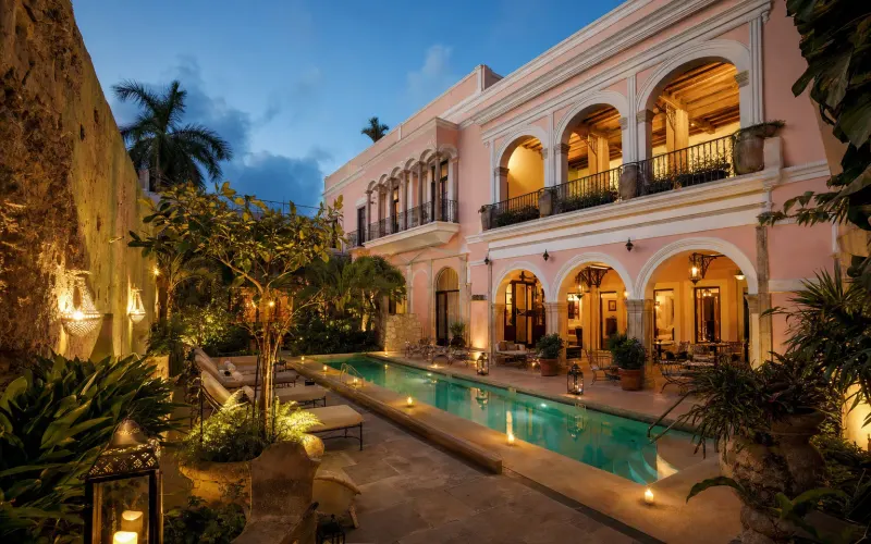 AI-generated editorial dusk view of Casa Don Gustavo Boutique Hotel in Campeche, Mexico