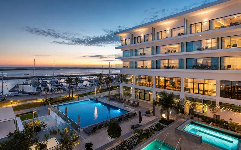 AI-generated editorial dusk view of Real Marina Hotel & Spa in Olhao, Portugal